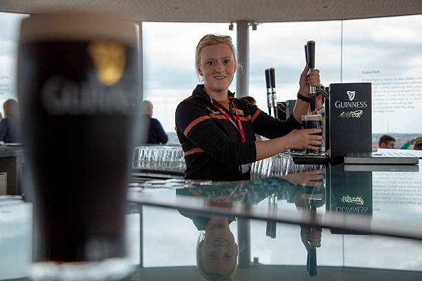 pouring a guinness on tap