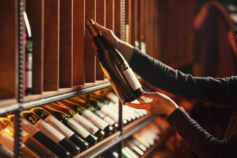 why do wine racks lean forward